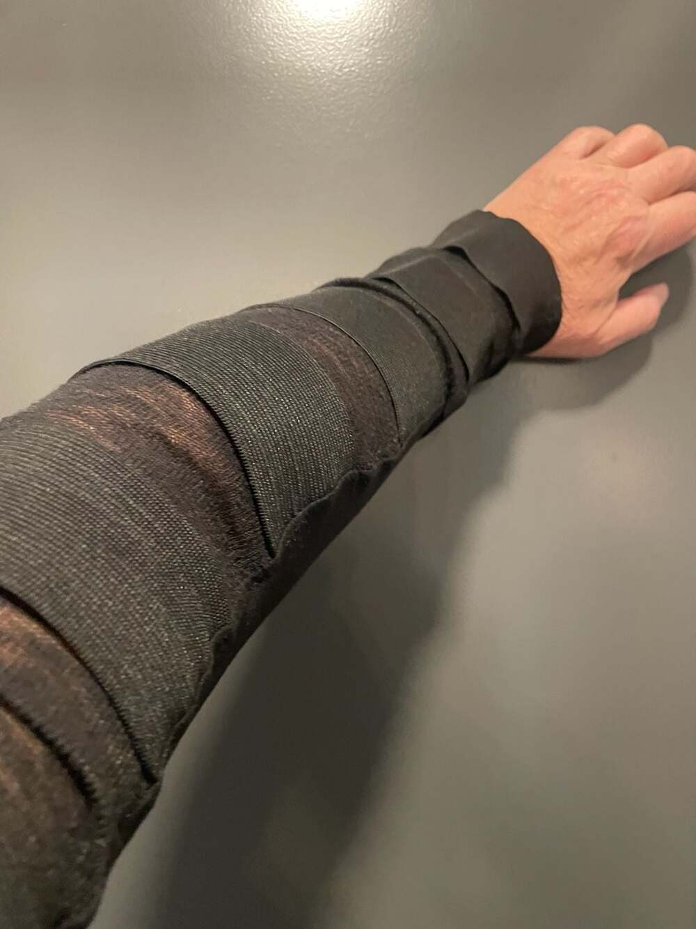 Unplugged Museum Black Multi-Strap Elastic Long Sleeve Top